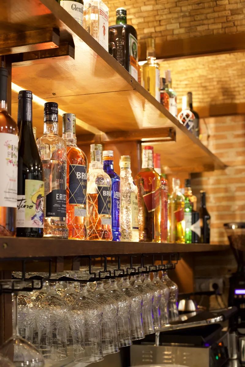 Bar at Taberna el Corcho with backlit bottles